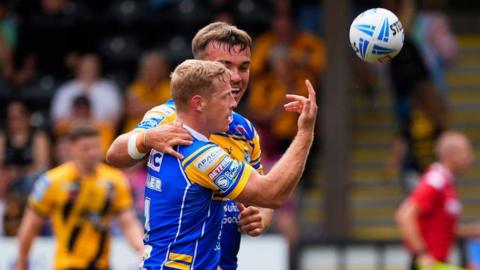 Lachie Miller tosses the ball away after scoring Rhinos second try