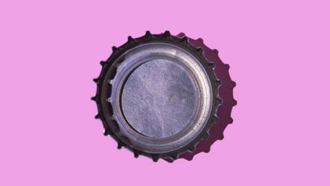 bottle cap on a pink background