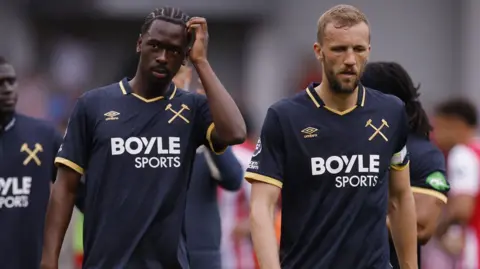 West Ham players walk off disappointed