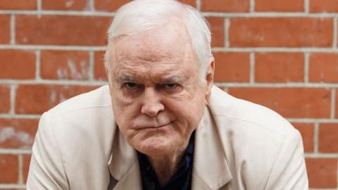 John Cleese poses before a Q&A session with the media ahead of the opening of Fawlty Towers The Play, which opens on Saturday, at the Apollo Theatre, central London. Picture date: Thursday May 2, 2024