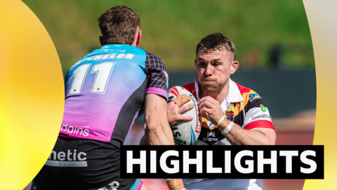 Sam Hallas of Bradford is tackled by Joe Batchelor of Hull FC