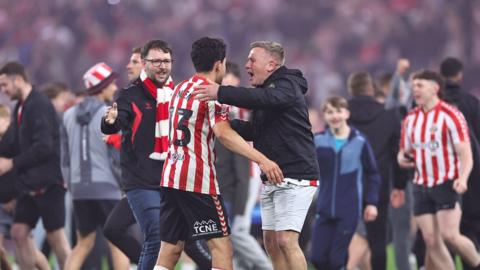 Luke O'Nien celebrates with fans after Sunderland's Championship play-off semi-final win against Coventry City at the Stadium of Light.