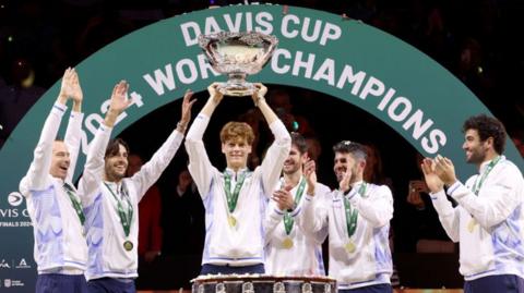 Jannik Sinner of Italy lifts Davis Cup trophy