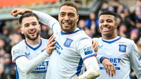 Rangers' Nicolas Raskin, Cyriel Dessers and Hamza Igamane celebrate