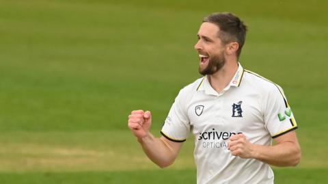 Chris Woakes celebrates a wicket
