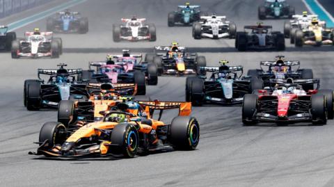 McLaren's Lando Norris leads into the first corner of the Miami Grand Prix sprint