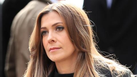 Kym Marsh dressed in black