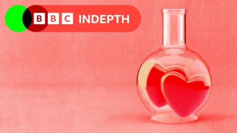 A treated image of a glass beaker with two hearts inside