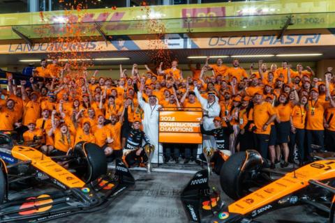 The McLaren F1 team celebrating winning the constructors' title after the 2024 Abu Dhabi Grand Prix