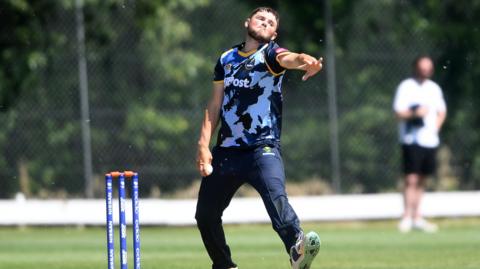 Tom Norton of Glamorgan bowling