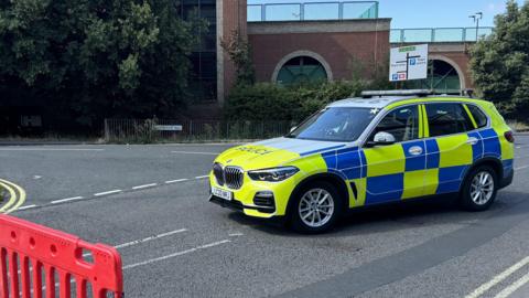 A police car blocks off access to Burrell Road, Ipswich following a murder 