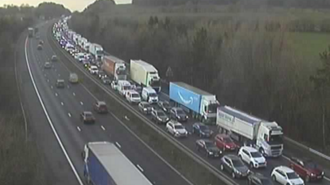 A queue of traffic over three lanes of the motorway