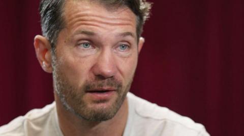 Headshot of Mark Phillips being interviewed by BBC Sport.