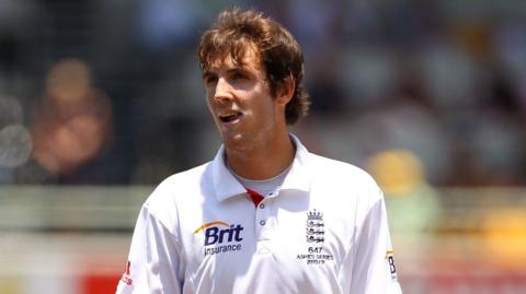Steven Finn looks on