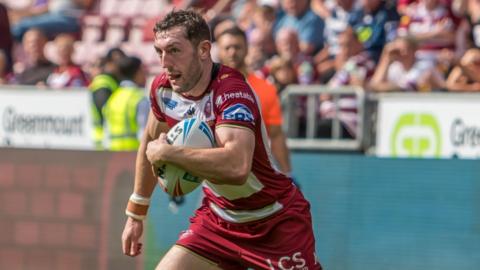 Wigan Warriors' Jake Wardle carrying ball in hand