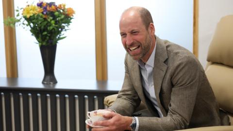 Britain's Prince William, The Duke of Cornwall, reacts as he speaks with care home residents during his visit to the Isles of Scilly Hospital on the day he officially opens a new facility there, in St Mary's, Isles of Scilly, Britain, May 22, 2026.