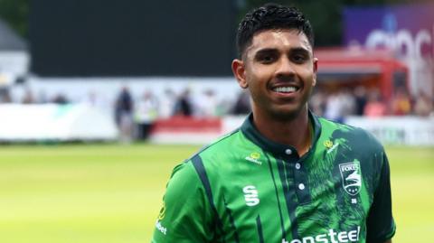 Rishi Patel walking off after batting for Leicestershire