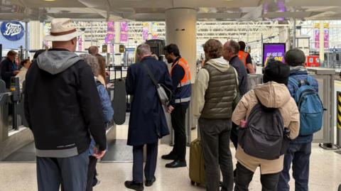 People waiting at Waterloo Station