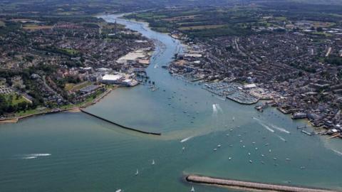 Aerial view of Cowes on the Isle of Wight. This sea port town, famous for yacht racing is located on the west bank of the Medina estuary over looking East Cowes on the east bank,on the northern coastline of the Isle of Wight. 