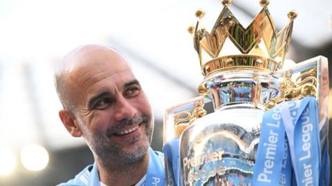 Pep Guardiola with the Premier League trophy in May 2024