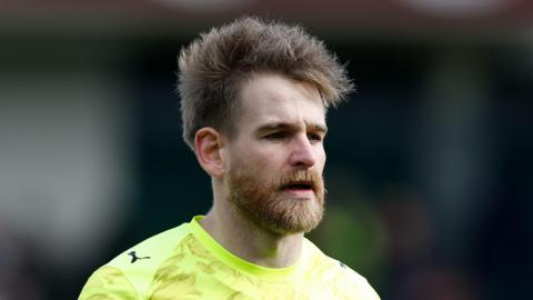 Lee Burge in action for Northampton Town.
