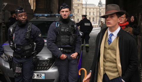 French 15-year-old Pedro Elias Garzon Delvaux, pictured in a waiscoat and a fedora hat outside the Louvre after the robbery, 19 October 2025