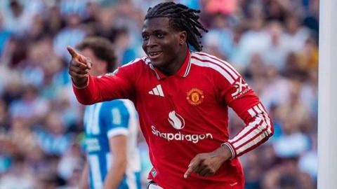 Manchester United's Patrick Dorgu celebrates scoring against Brighton