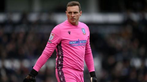 David Stockdale in a pink Sheffield Wednesday kit during the Sky Bet League One between Derby County and Sheffield Wednesday at Pride Park Stadium on December 03, 2022 in Derby, England