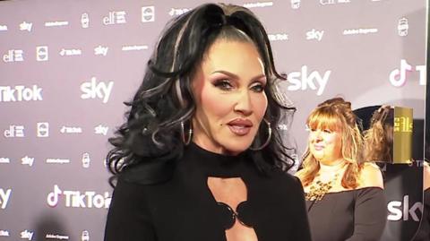 Michelle Visage speaks to the press on the red carpet