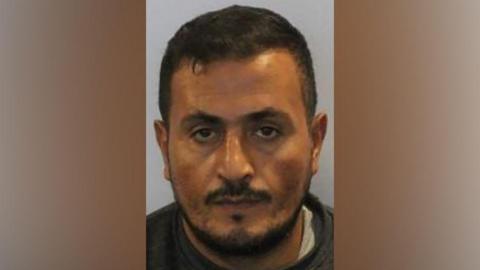 A mugshot of Ebid