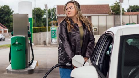 Oman putting petrol in car