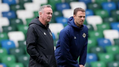 NI manager Michael O'Neill and Jonny Evans