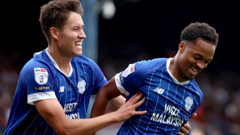 Chris Willock (right) celebrates his goal with Rubin Colwill