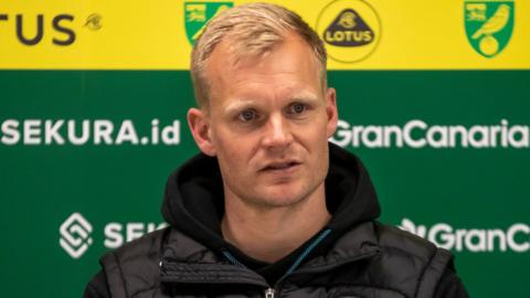 Liam Manning in the Norwich City press room while Bristol City boss