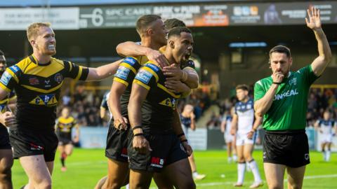 Castleford's Jason Qareqare leads the celebrations after his try against Hull FC