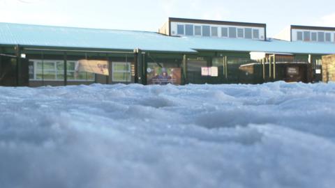 Atlas school with snow on the roof and in the foreground.