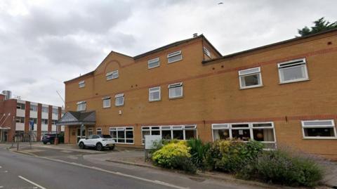 Streetview image of Falcon House, a three storey brick building sited on a road junction