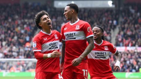 Morgan Whittaker celebrates his first goal against Watford with Jeremy Sarmiento (left) and Sontje Hansen (right, just behind him) 