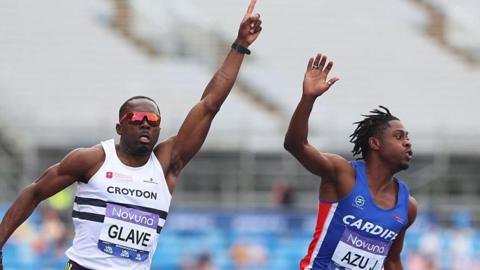 Romell Glave of celebrates as he crosses the finish line to win gold ahead of Jeremiah Azu 