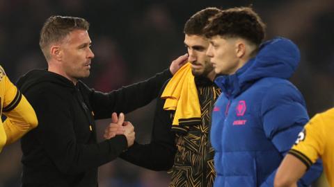 Rob Edwards consoles his Wolves players