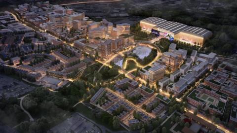 CGI of the Brabazon site in Bristol. Thousands of homes can be seen from an aerial view, with the arena centre stage and lit up.