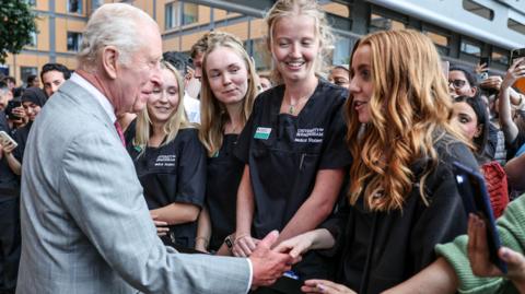The King with nurses at at the opening of a new hospital in Smethwick