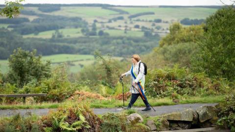 Sheila Mahon as she walks round Ilkley Tarn, on Ilkley Moor, to raise money for charity