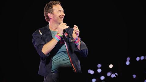Chris Martin of Coldplay performs at Nissan Stadium on July 22, 2025 in Nashville, Tennessee as part of the band's Music of the Spheres World Tour. 