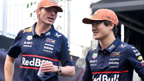 Max Verstappen in conversation with red Bull team-mate Yuki Tsunoda before the US Grand Prix sprint race