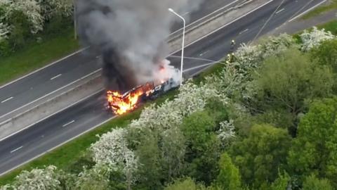 Firefighters tackle a bus fire on the A15.