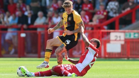 Kai Whitmore makes a tackle in Newport County's win at Crawley