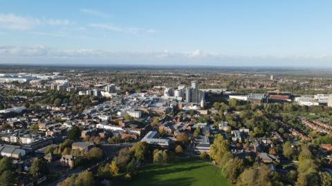 A bird's eye view of the town of Basingstoke on a clear day.