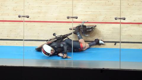 Archie Atkinson falls on the velodrome track at the 2024 Paralympics in Paris