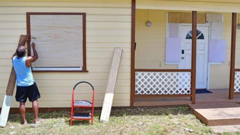 A man boards up a house ahead of the arrival of Hurricane Beryl in Bridgetown, Barbados. Photo: 30 June 2024